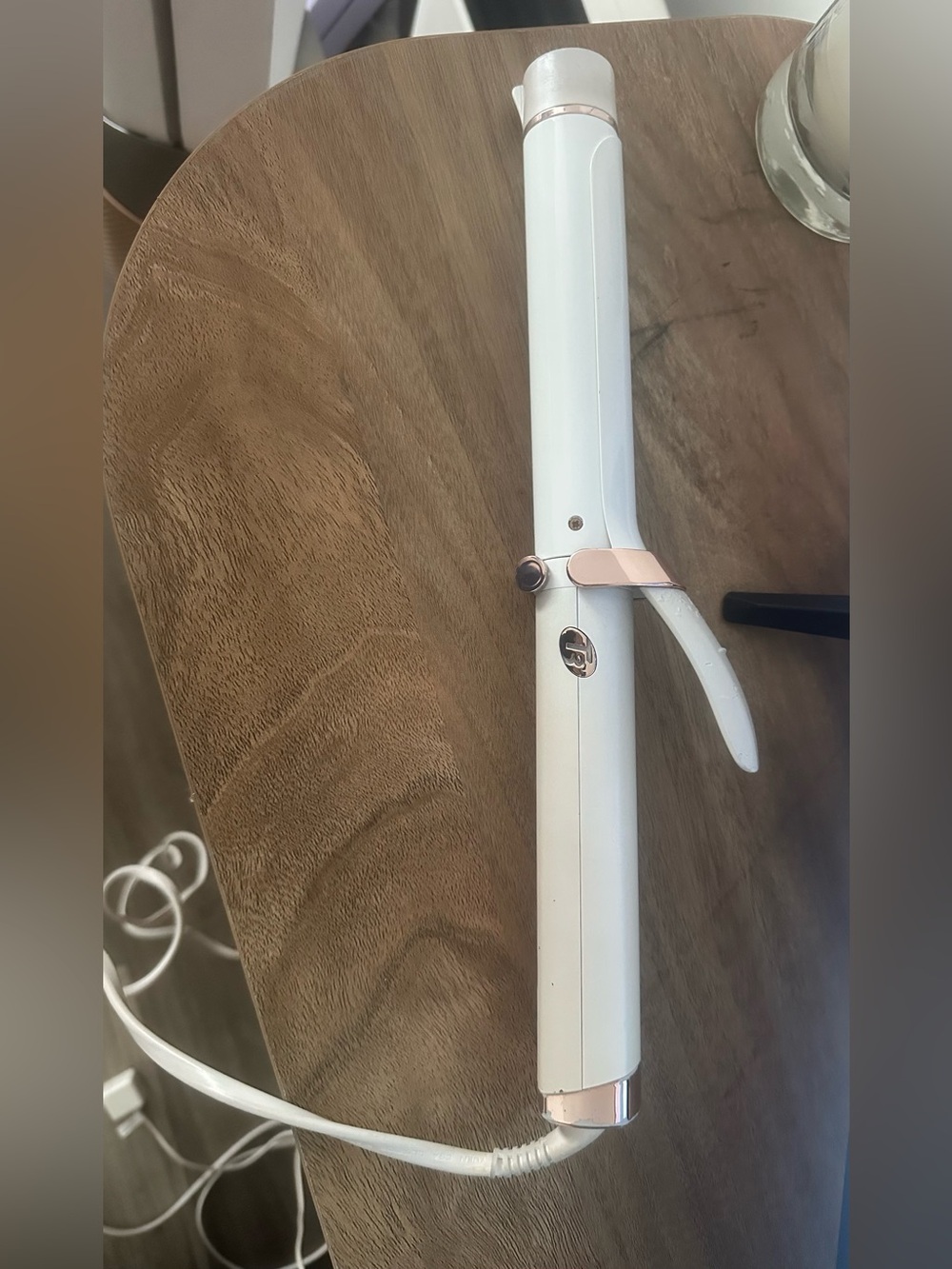T3 Curl ID 1.25" Smart Curling Iron used has somewhere in here, but still works